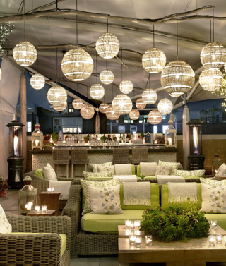 Night wide shot of the Roof Terrace at Ham Yard Hotel