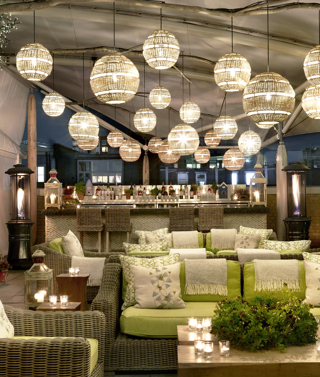 Night wide shot of the Roof Terrace at Ham Yard Hotel