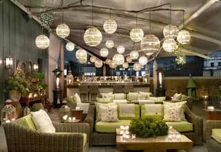 Night wide shot of the Roof Terrace at Ham Yard Hotel