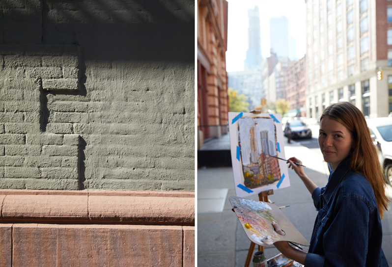 An artist paints  the view from a street in Tribeca, NY