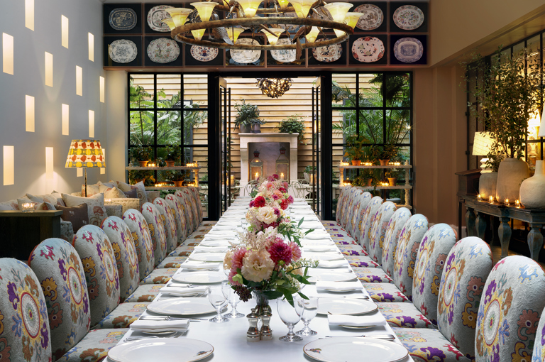 Close shot of long dining tables set-up in the Orangery private events room at the Whitby Hotel