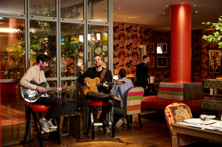 Two guitarists playing at Refuel