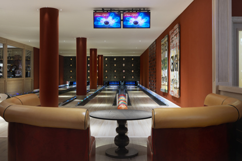 Close shot of a seating area and Croc Bowling Alley at Ham Yard Hotel