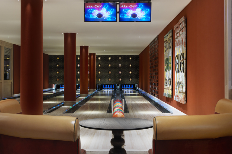 Close shot of a seating area and Croc Bowling Alley at Ham Yard Hotel