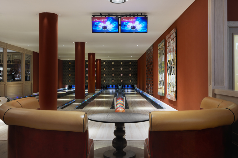 Close shot of a seating area and Croc Bowling Alley at Ham Yard Hotel
