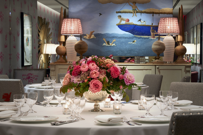 Close shot of a round dining table set-up in the Spring private events room at Crosby Street Hotel