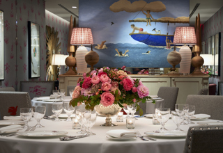 Close shot of a round dining table set-up in the Spring private events room at Crosby Street Hotel
