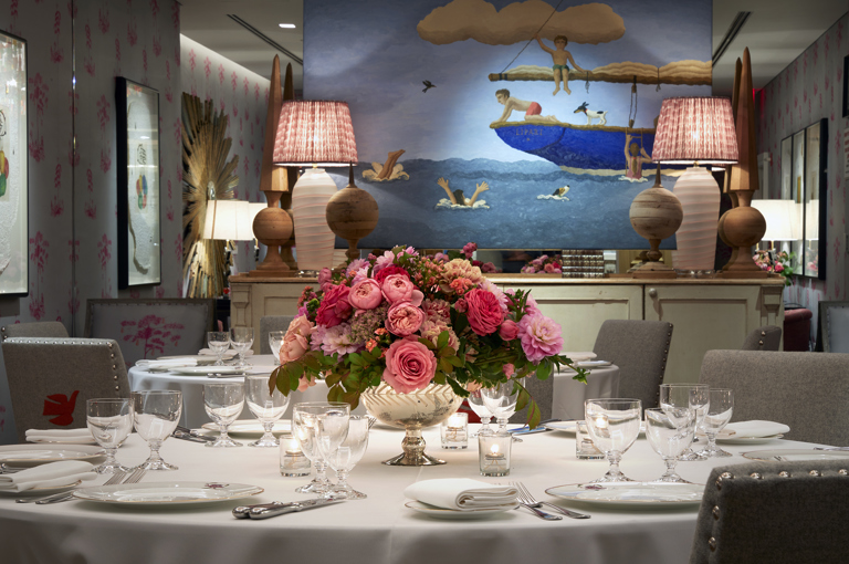 Close shot of a round dining table set-up in the Spring private events room at Crosby Street Hotel