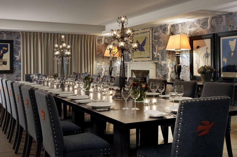 Long dining table set-up in the Nash private events room at Haymarket Hotel