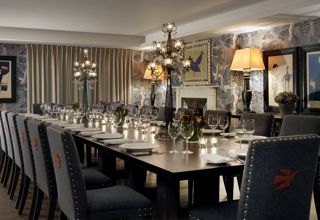 Long dining table set-up in the Nash private events room at Haymarket Hotel