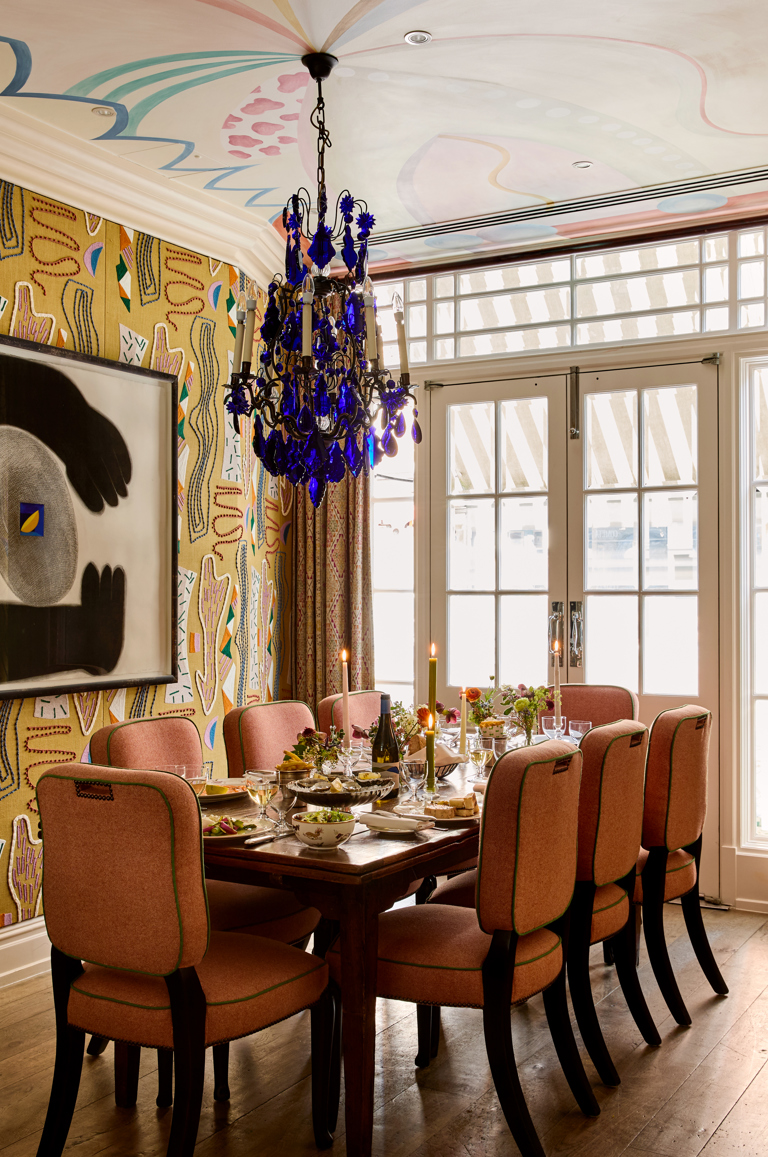 A portrait shot of the Dora Carrington event space at Charlotte Street Hotel: the table is set up for private dining for eight people with lunch dishes being shared