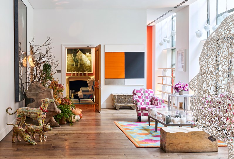 The lobby at Crosby Street Hotel filled with sculptures and contemporary artwork