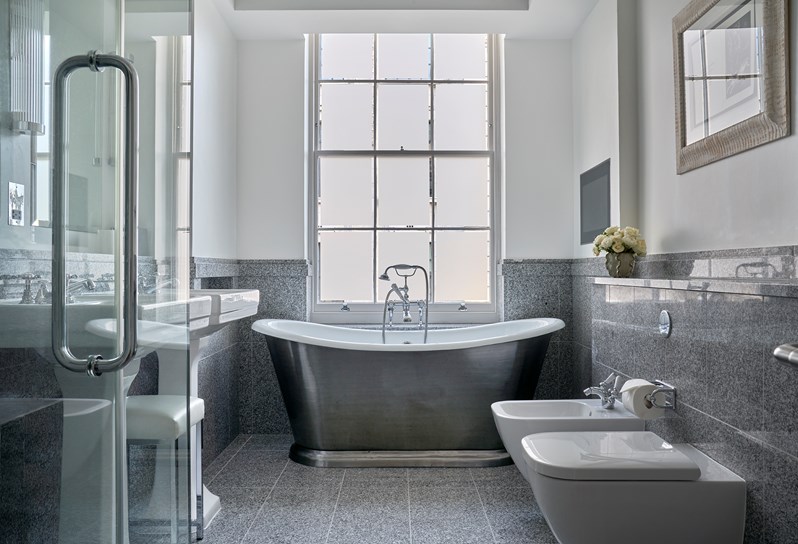 A bathroom in a Luxury Junior Suite at Haymarket Hotel