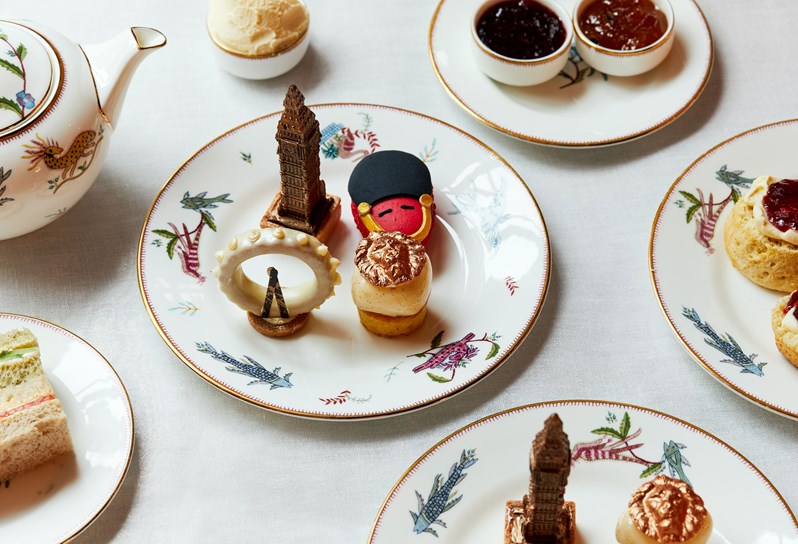 Miniature cakes in an Afternoon Tea. They are designed to replicate, a King's Guard, Big Ben, the London Eye and Trafalgar Square