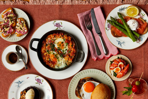 Multiple dishes from The Weekend Brunch menu at Oscar, Charlotte street Hotel. Including Shaksuka, loaded hash browns, the McOscar Muffin, Toasted chocolate and hazelnut brioche and lobster toasted crumpets with soft boiled quail’s eggs.
