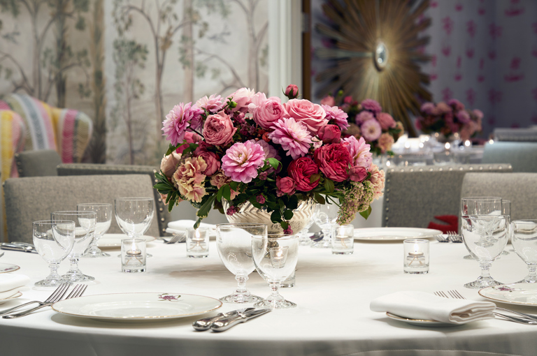 Close shot of a round dining table in the Prince private events room at Crosby Street Hotel