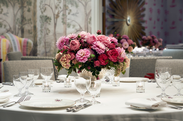 Close shot of a round dining table in the Prince private events room at Crosby Street Hotel