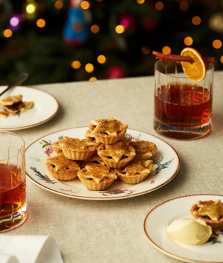 Portrait shot of a festive table with a plate of mince pies