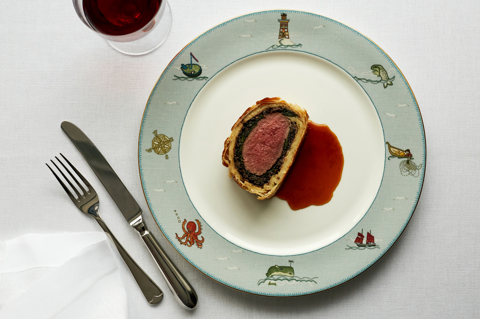 A slice of venison wellington on a plate at Ham Yard