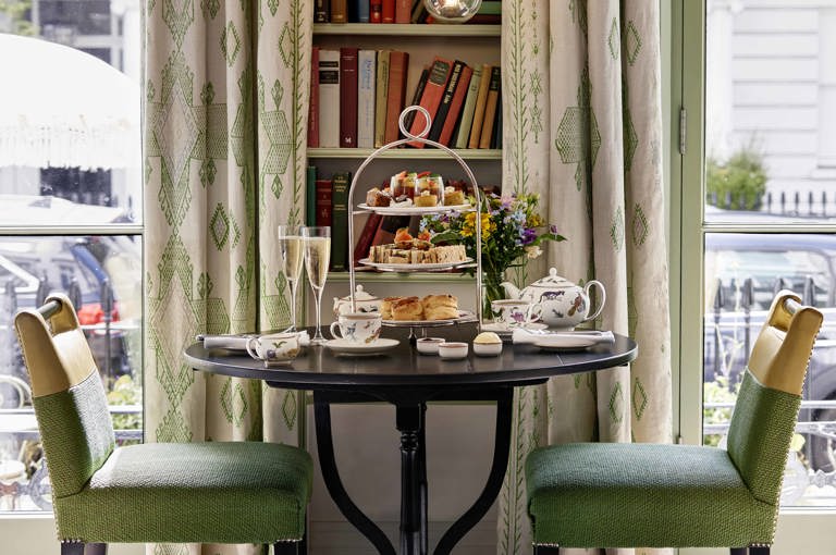 Wide shot of Traditional Afternoon Tea with Champagne in the library at Number Sixteen