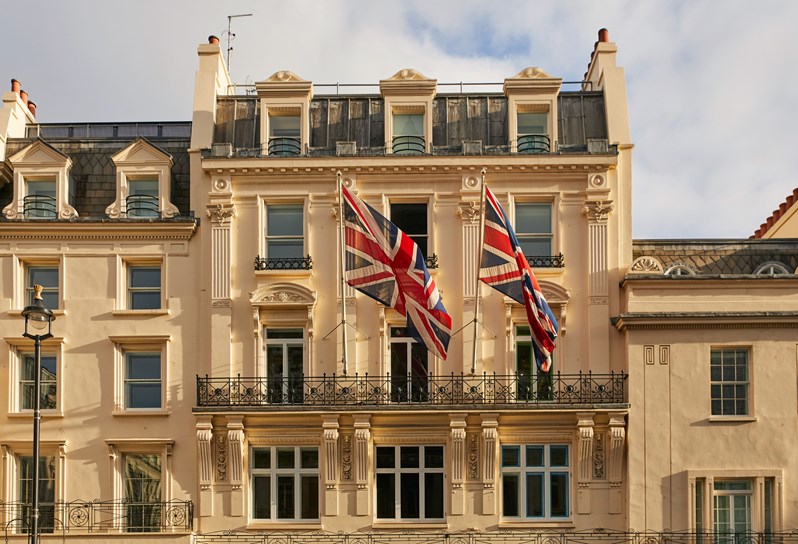 An image of the exterior of Haymarket Hotel, focusing on the flags.