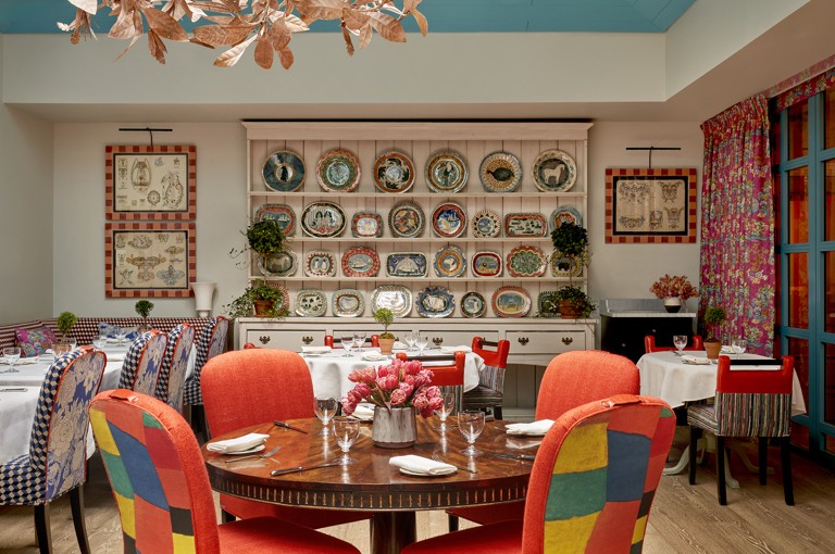 Round dining tables set-up in the Orangery private events room at Warren Street Hotel