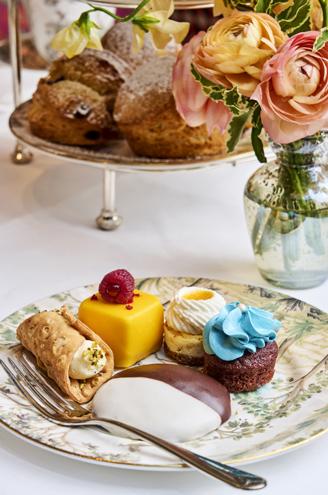 A portrait close-up shot of the cakes and scones served as part of the New York Afternoon Tea at Warren Street Bar