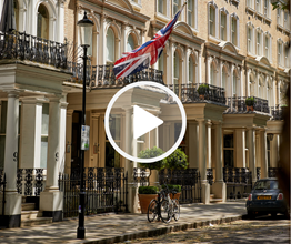 Images of a terraced street in London with a union jack flag flying outside with a play button overlaid