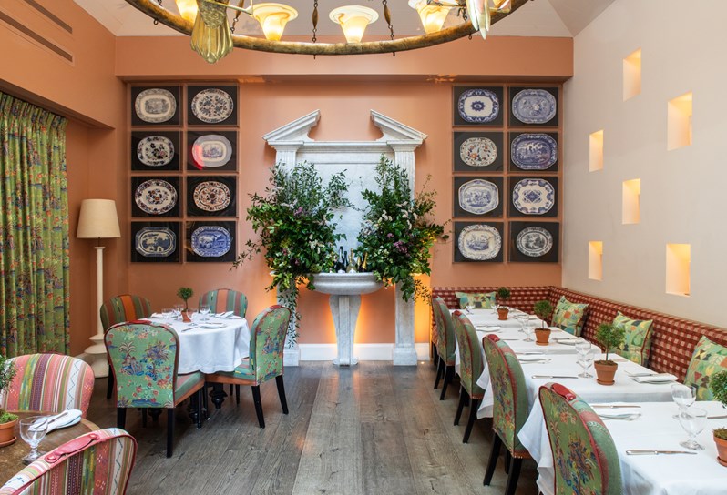 Both square and round dining tables set-up in the Orangery private events room at The Whitby Hotel.