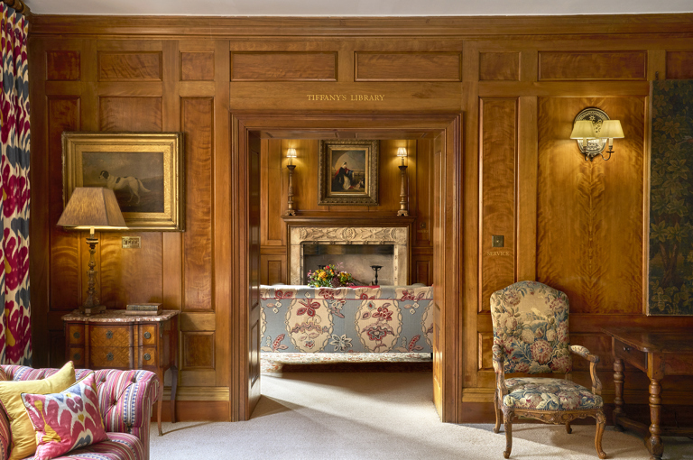 A shot taken looking through the entrance to the library at Covent Garden Hotel from the drawing room