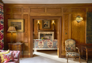 A shot taken looking through the entrance to the library at Covent Garden Hotel from the drawing room