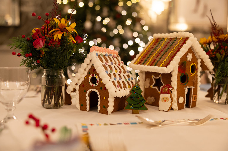 A landscape shot of two gingerbread houses on a table at Haymarket Hotel