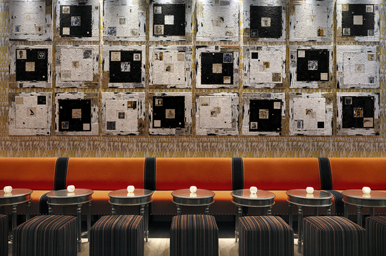 A wide shot of the low bar banquette and seating area at Ham Yard