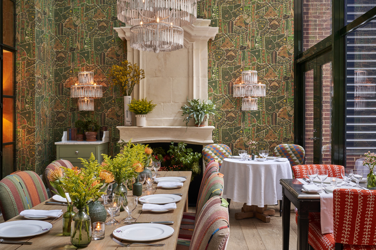 Long dining table set-up in the Orangery private events rooms at Crosby Street Hotel