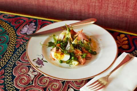 Close up shot of a trout salad starter on a plate at Refuel