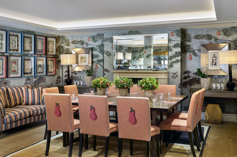 Squared dining table set-up in the Duncan Grant private events room at Charlotte Street Hotel