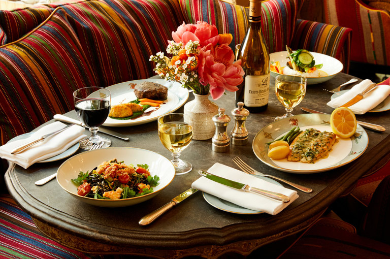 A zoomed in image of multiple seasonal dishes on the table, at the Whitby Bar.