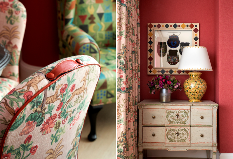A dining chair upholstered in a pink patterned fabric and a chest of drawers with a decorative lamp and a vase of flowers
