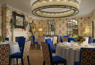 Round dining tables set-up in the Fortune private events room at Covent Garden Hotel