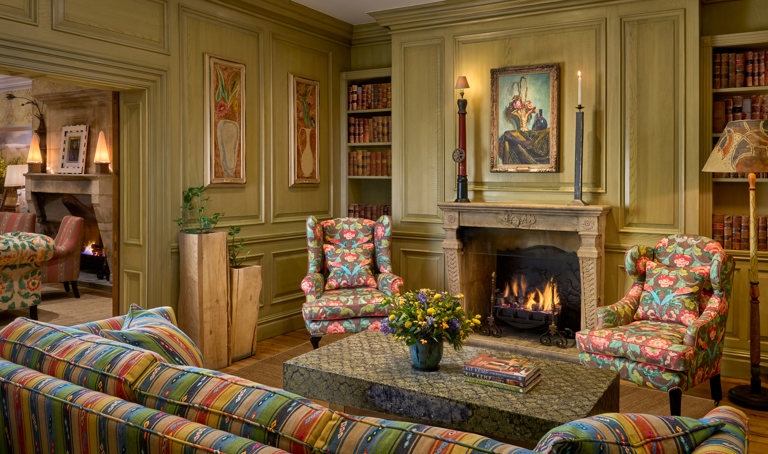 Wide shot of the fireplace in the Library at Charlotte Street Hotel