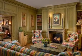 Wide shot of the fireplace in the Library at Charlotte Street Hotel