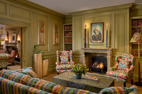 Wide shot of the fireplace in the Library at Charlotte Street Hotel