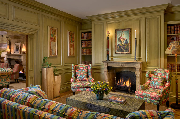 Wide shot of the fireplace in the Library at Charlotte Street Hotel