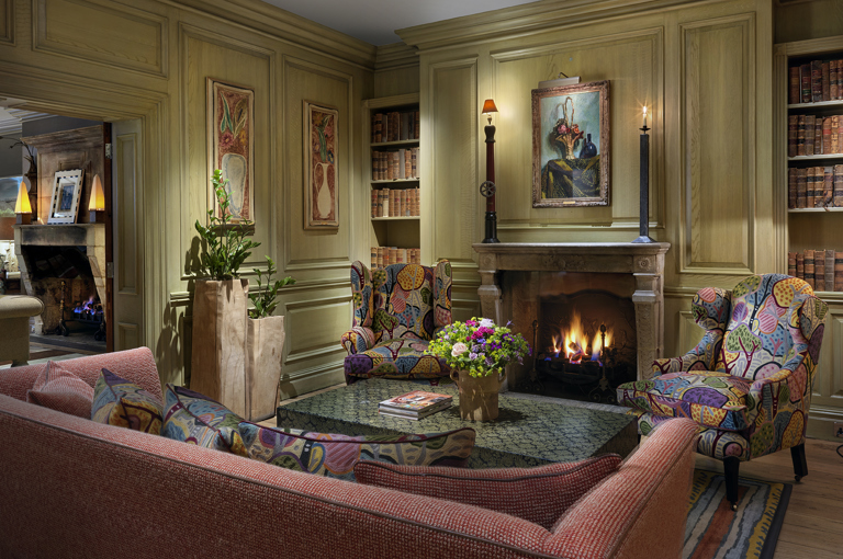 Wide shot of the fireplace in the Library at Charlotte Street Hotel