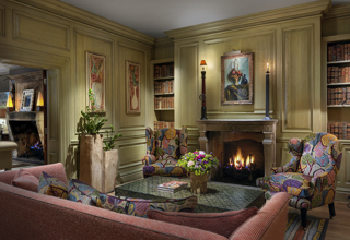 Wide shot of the fireplace in the Library at Charlotte Street Hotel