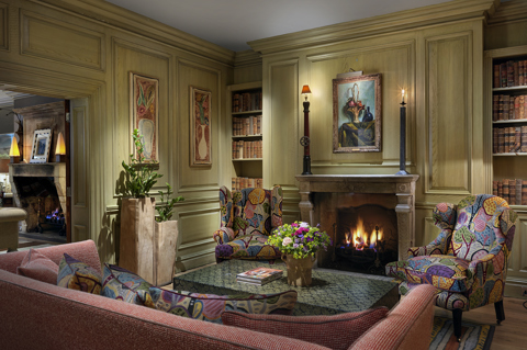 Wide shot of the fireplace in the Library at Charlotte Street Hotel