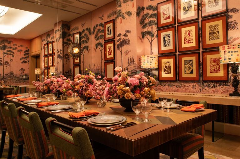 Diagonal shot of a long dining table set-up in the Araminta private events room at the Whitby Hotel