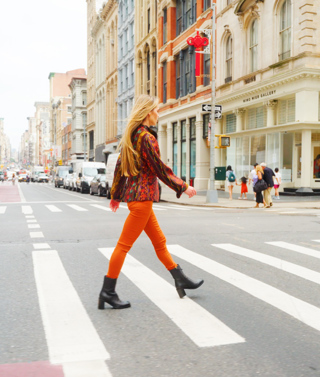 Firmdale Hotels' Design Director and Art Ambassador Willow Kemp, walks over a cross walk on the streets of Tribeca
