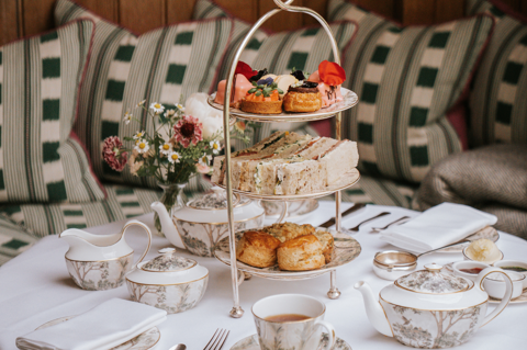 Close up shot of Traditional Afternoon Tea with Champagne in the pergola in the garden at Number Sixteen