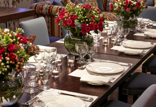 Close shot of a long dining tables in the Rocklin private events room at Haymarket Hotel